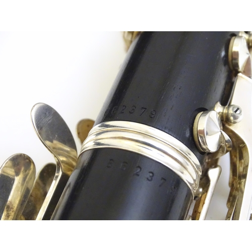 1062 - Musical Instrument : a late 20thC E11 clarinet by Buffet Crampon & Cie, Paris. Constructed from turn... 