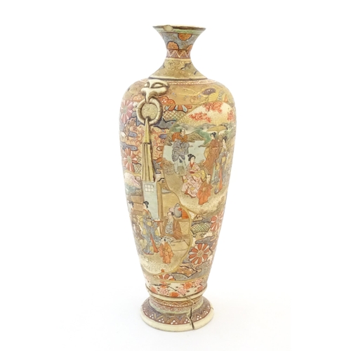 16 - A Japanese satsuma vase with relief twin handles and panelled decoration depicting figures in landsc... 