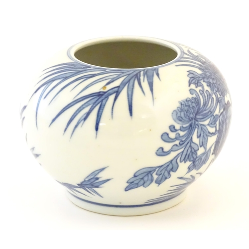 2 - A Chinese blue and white pot decorated with birds, flowers and foliage. Character marks under. Appro... 