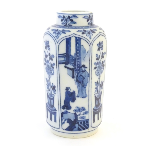 27 - A Chinese blue and white vase with panelled decoration depicting flowers and figures. Marked with le... 
