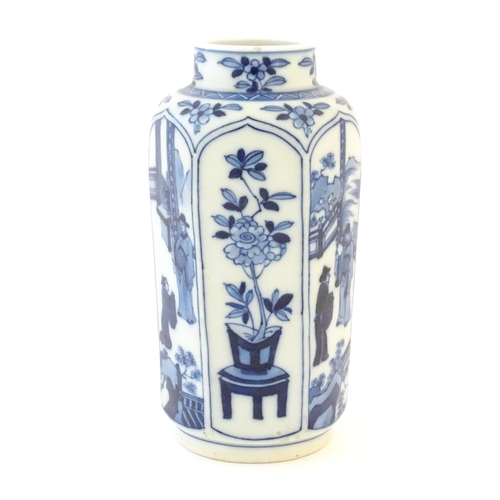 27 - A Chinese blue and white vase with panelled decoration depicting flowers and figures. Marked with le... 