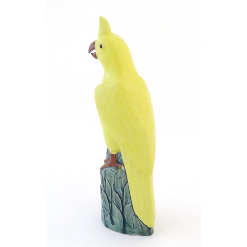36 - A Chinese model of a yellow cockatiel style bird. Impressed marks under. Approx. 9 3/4