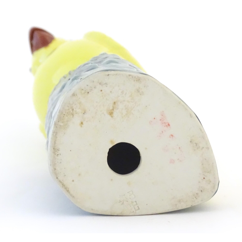 36 - A Chinese model of a yellow cockatiel style bird. Impressed marks under. Approx. 9 3/4