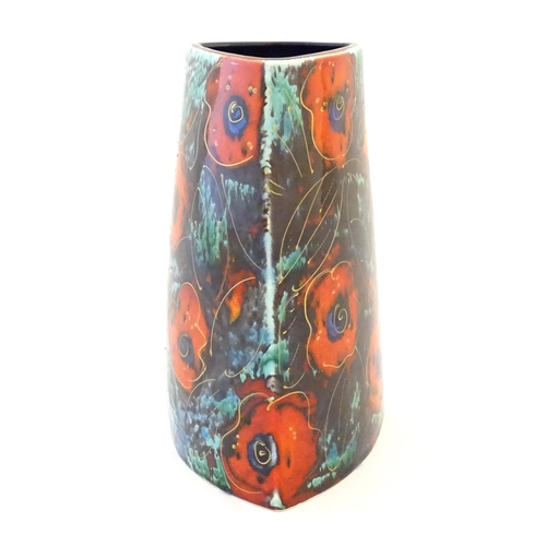 49 - A studio pottery vase decorated with stylised poppy flowers, by Anita Harris. Marked under. Approx. ... 