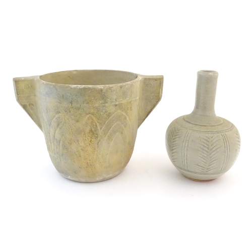 51 - Two items of studio pottery comprising a bottle vase with incised stylised foliate detail. Impressed... 
