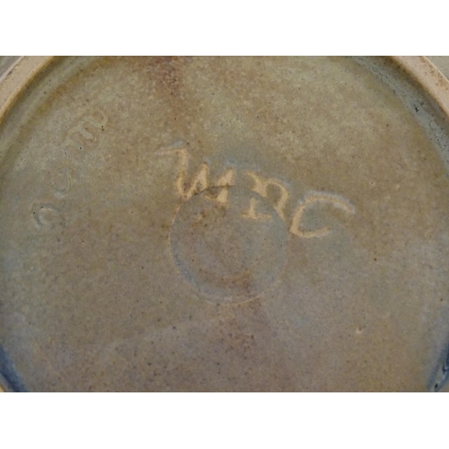 55 - A studio pottery bowl with abstract detail signed under Jam. Together with a studio pottery blue gla... 