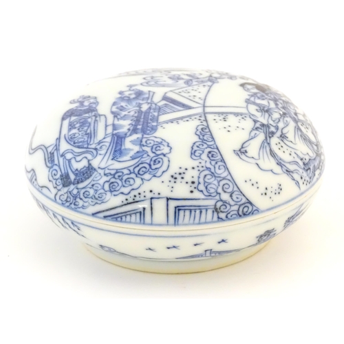 8 - A Chinese blue and white ink box and cover of circular form decorated with figures in landscapes, fl... 