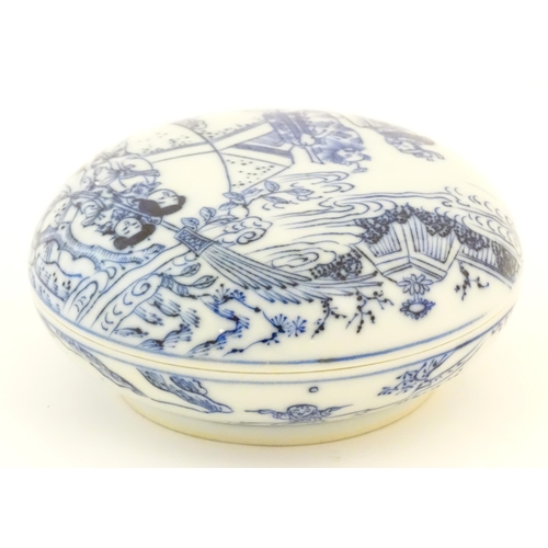 8 - A Chinese blue and white ink box and cover of circular form decorated with figures in landscapes, fl... 