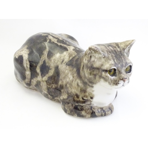 1745 - A large Winstanley model of a recumbent Tabby cat. Marked under, no. 7. Approx. 13 1/4