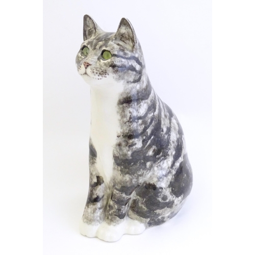 1746 - A large Winstanley model of a seated Tabby cat with green eyes. Marked under, no. 6. Approx. 12 1/2