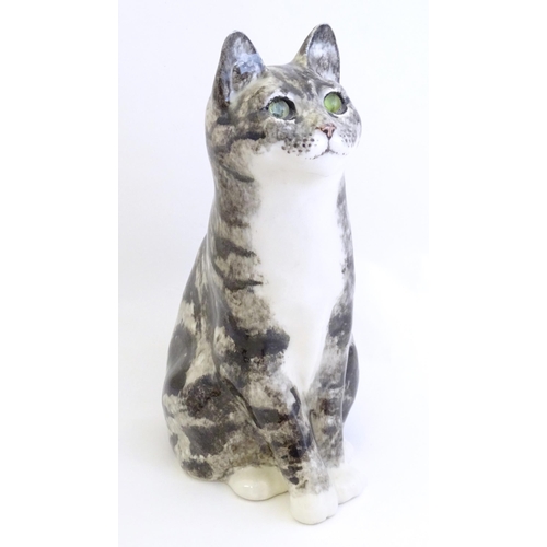 1746 - A large Winstanley model of a seated Tabby cat with green eyes. Marked under, no. 6. Approx. 12 1/2