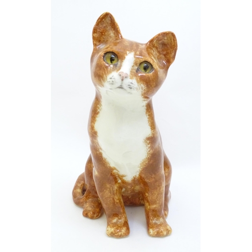 1748 - A Winstanley model of a seated Ginger cat. Marked under, no. 26. Approx. 8 3/4