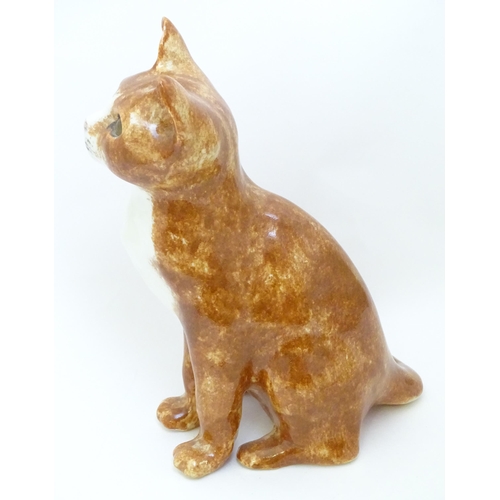 1748 - A Winstanley model of a seated Ginger cat. Marked under, no. 26. Approx. 8 3/4