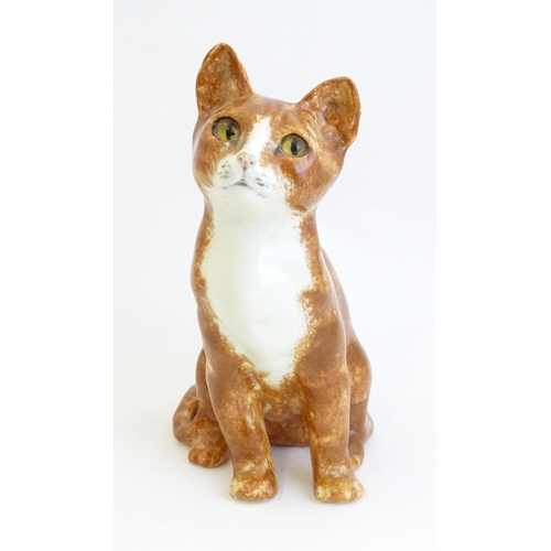 1748 - A Winstanley model of a seated Ginger cat. Marked under, no. 26. Approx. 8 3/4