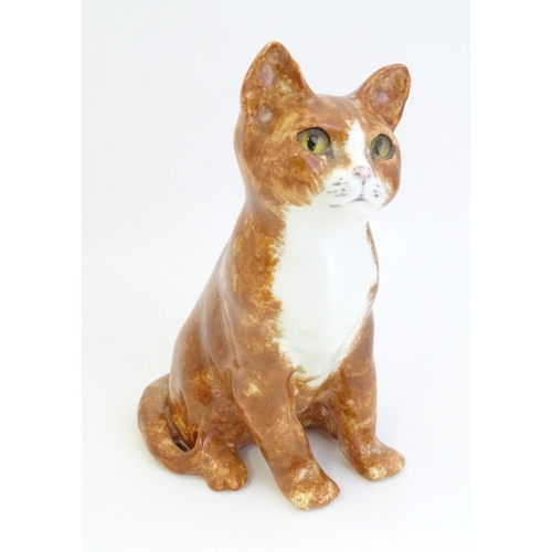 1748 - A Winstanley model of a seated Ginger cat. Marked under, no. 26. Approx. 8 3/4