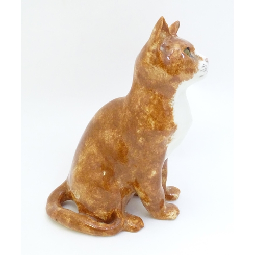 1748 - A Winstanley model of a seated Ginger cat. Marked under, no. 26. Approx. 8 3/4