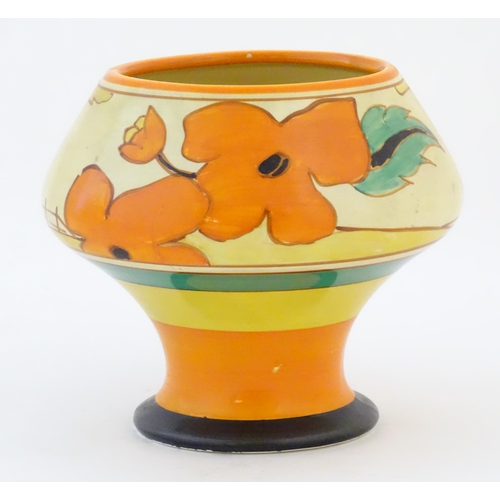 73 - A Clarice Cliff pedestal bowl in the Red Roofs pattern, decorated with stylised flowers. Marked unde... 