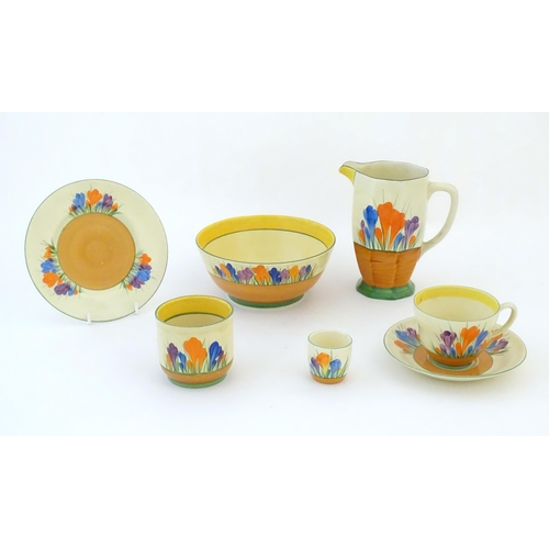 78 - A quantity of Clarice Cliff early morning / breakfast wares in the Crocus pattern, comprising milk j... 