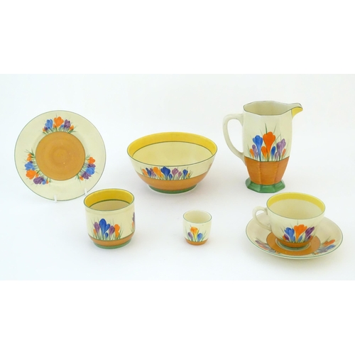 78 - A quantity of Clarice Cliff early morning / breakfast wares in the Crocus pattern, comprising milk j... 