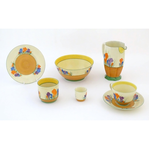 78 - A quantity of Clarice Cliff early morning / breakfast wares in the Crocus pattern, comprising milk j... 