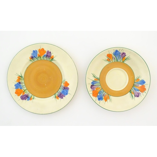 78 - A quantity of Clarice Cliff early morning / breakfast wares in the Crocus pattern, comprising milk j... 