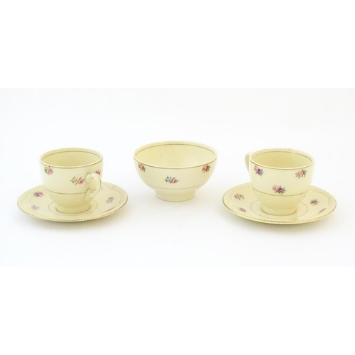 79 - A quantity of Clarice Cliff tea wares with floral decoration and gilt highlights, comprising two tea... 