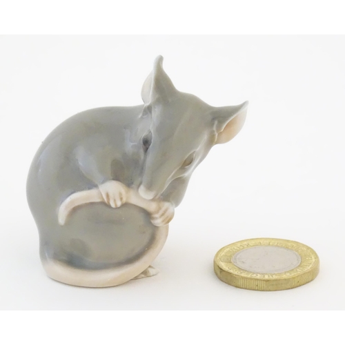 81 - A Bing & Grondahl model of a mouse, no. 1801. Marked under. Approx. 1 3/4