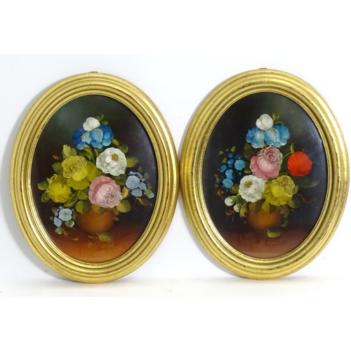 1143 - R. Rosini, 20th century, Oil on board, A pair of oval still life studies with flowers in bloom. Sign... 