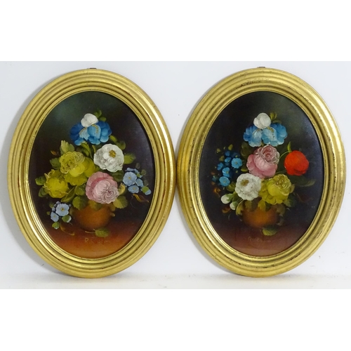 1143 - R. Rosini, 20th century, Oil on board, A pair of oval still life studies with flowers in bloom. Sign... 