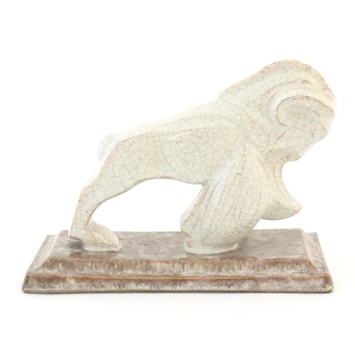 45 - A French Art Deco model of a ram with a crackle glaze on a stepped rectangular base. Impressed marks... 
