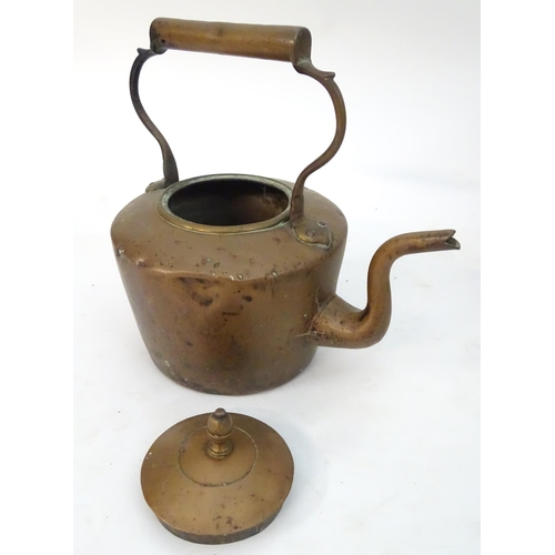 145 - An assortment of brass and copper items, comprising a large stove pan, a helmet coal scuttle, a log ... 