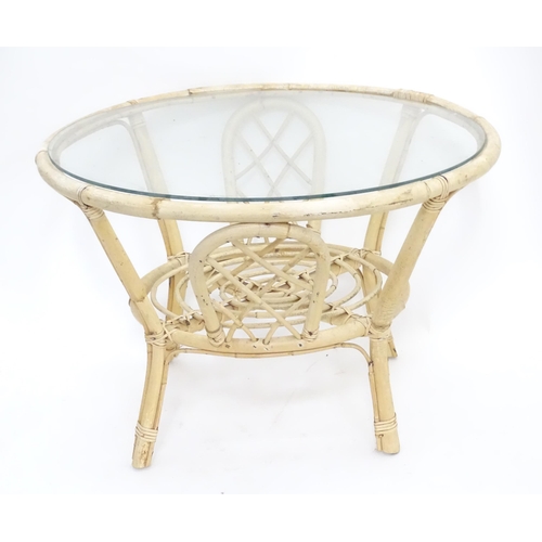 150 - A painted bentwood circular table with glazed top, together with three painted children's chairs. Ta... 