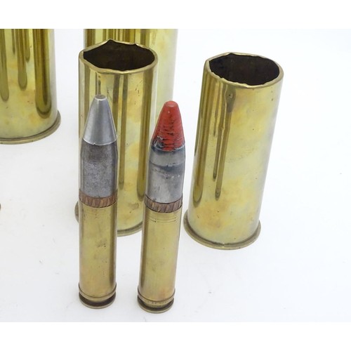 159 - Militaria: an array of 20thC artillery and cannon shell cases, including M14s, 37-25 anti-tank, airc... 