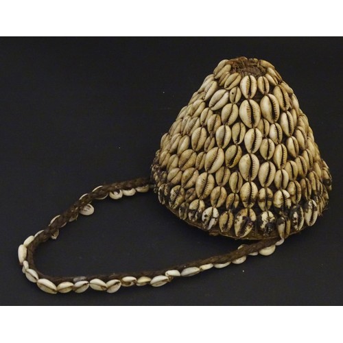 160 - Ethnographic / Native / Tribal: A woven basket with cowrie shell detail and loop handle. Basket appr... 