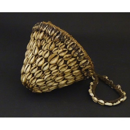 160 - Ethnographic / Native / Tribal: A woven basket with cowrie shell detail and loop handle. Basket appr... 