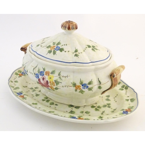 175 - A French twin handled lidded tureen and stand with hand painted floral and foliate detail. Marked un... 