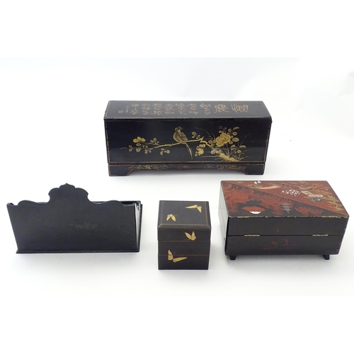 203 - Four Oriental lacquered items comprising a desk tidy / organiser with shaped back decorated with a w... 