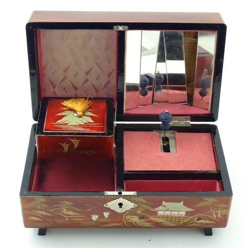 203 - Four Oriental lacquered items comprising a desk tidy / organiser with shaped back decorated with a w... 