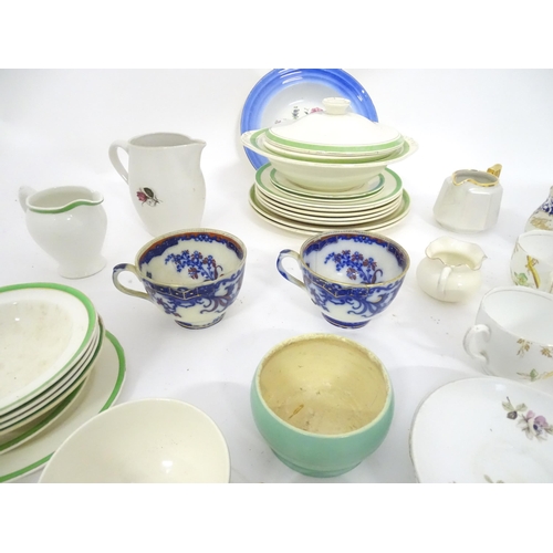 204 - A quantity of assorted dinner and tea wares to include plates, serving bowls, cups, jugs, cups, sauc... 