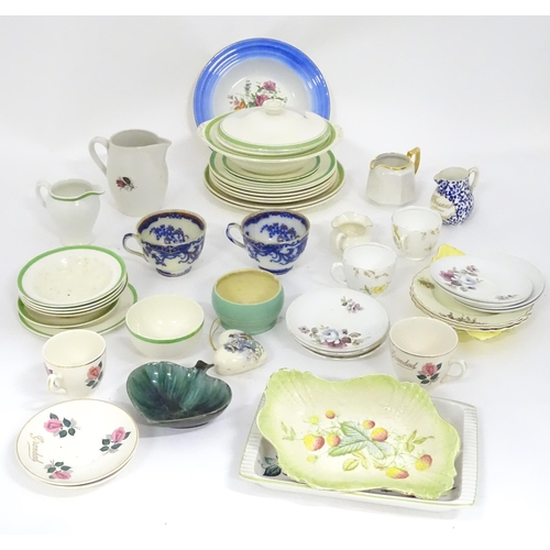 204 - A quantity of assorted dinner and tea wares to include plates, serving bowls, cups, jugs, cups, sauc... 