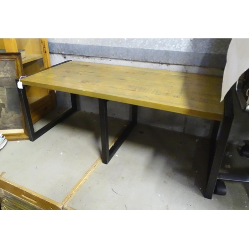 215 - A modern coffee table with metal supports. Approx. 43 1/2