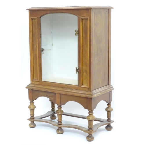 217 - A William and Mary style pier cabinet with glazed door. Approx 40