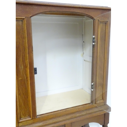 217 - A William and Mary style pier cabinet with glazed door. Approx 40