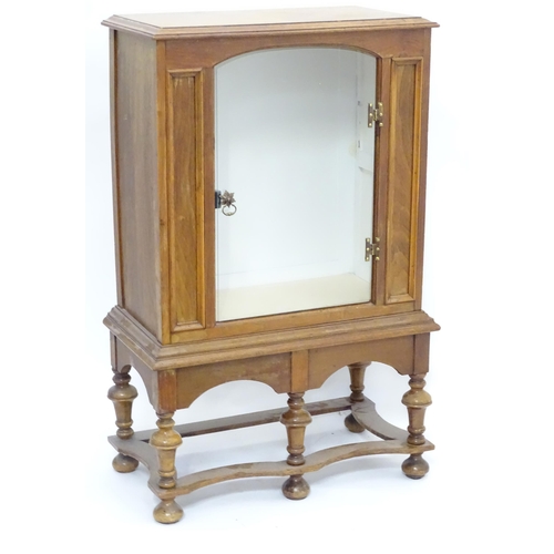 217 - A William and Mary style pier cabinet with glazed door. Approx 40