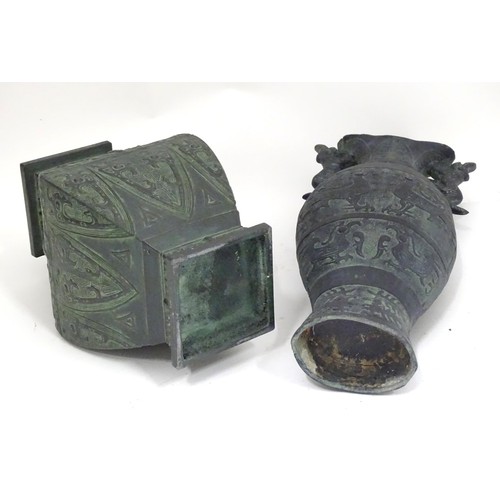 184 - Two Oriental cast vases with stylised animal decoration