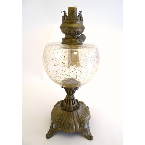 268 - An early 20thC Royal Zanzara oil lamp, the large clear glass reservoir with gold flecked indentation... 