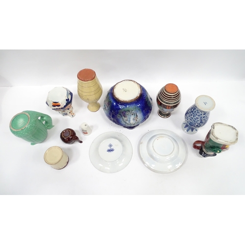 122 - A quantity of assorted ceramics to include a green Sylvac squirrel jug of acorn form, no. 1959; a te... 