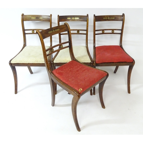 15 - Four regency rosewood chairs with brass inlay. 31