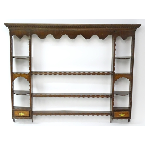 234 - A Georgian oak plate rack with moulded cornice above dental carved frieze. Approx 70