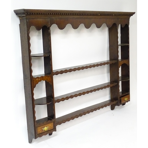 234 - A Georgian oak plate rack with moulded cornice above dental carved frieze. Approx 70